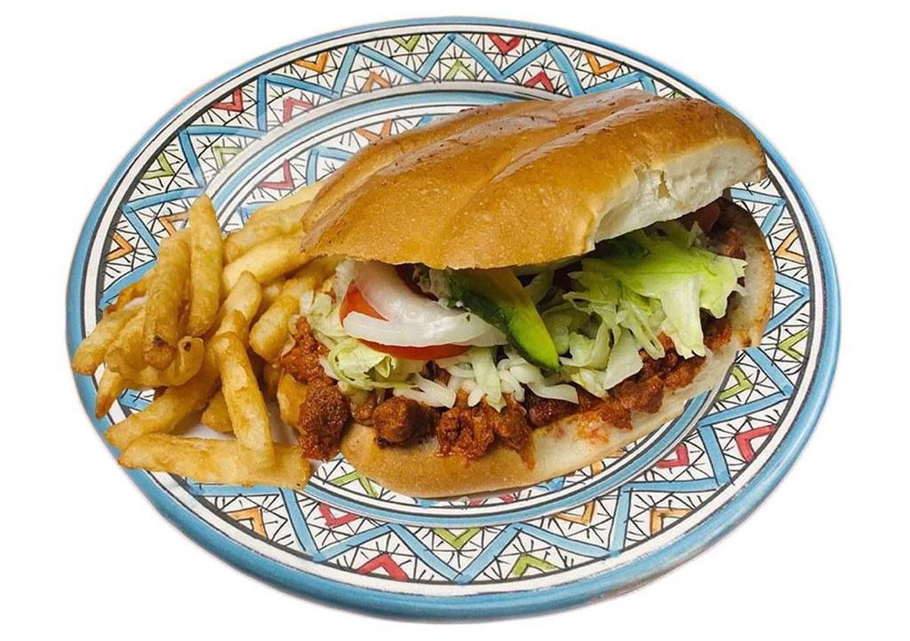 Torta Cubana · Prepared with breaded steak, sausage with egg, ham, hot dog sausage mayo, lettuce, tomato, avocado, onion, jalapeno, mozzarella cheese and beans garnishes such as french fries.