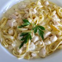 Chicken Fettucini Alfredo · Grilled chicken breast, Parmesan cream sauce and topped with baked mozzarella.