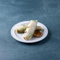 2 Spring Rolls · Rice noodles, lettuce and bean sprouts rolled in rice paper. Served with peanut sauce for di...