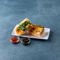 Veggie Tofu Sandwich · Served with pickled carrots and daikon, cucumber, cilantro, jalapenos, soy sauce and black p...