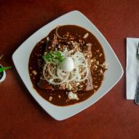 Mole Enchiladas Plate · 4 corn tortillas rolled with chicken, sauced in homemade dark mole, topped with queso fresco...