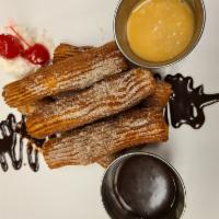 HOME MADE CHURROS  · HOMEMADE CHURROS, WITH CHOCOLATE SAUCE .DULCE DE LECHE, WHIPPED CREAM