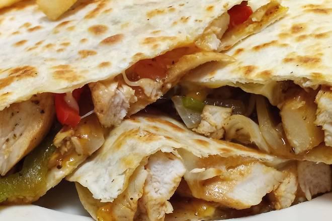 Chicken Quesadilla · Grilled chicken breast with peppers, onions, and cheddar cheese served is a grilled tortilla with sour cream ＆ a side of fries