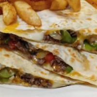 Steak Quesadilla · Grilled steak with peppers, onions, and cheddar cheese served in a grilled tortilla with sou...