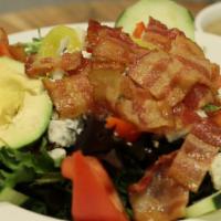 Cobb Salad · Mixed greens, cucumbers, tomatoes, olives, avocado, bacon and bleu cheese.