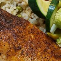 Blackened Filet of Salmon · Served with rice pilaf and mixed vegetables.