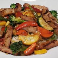 Chicken Stirfry · Chicken breast sauteed in a stir-fry sauce with peppers, onions, mixed vegetables, and serve...