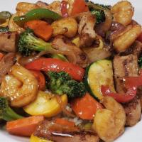 Chicken ＆ Shrimp Stir Fry · Chicken breast ＆ shrimp sauteed in a stir fry sauce with peppers, onions, mixed vegetables, ...