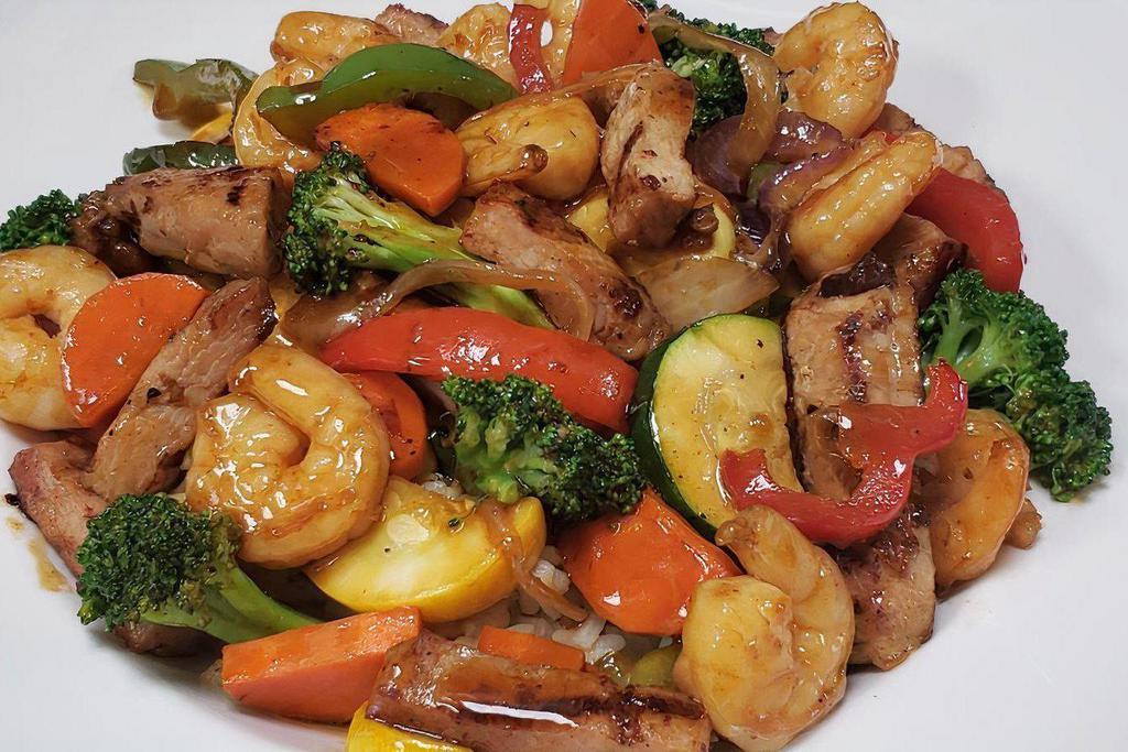 Chicken ＆ Shrimp Stir Fry · Chicken breast ＆ shrimp sauteed in a stir fry sauce with peppers, onions, mixed vegetables, and served over rice.