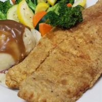 Blackened Grouper Dinner · Served with mashed potatoes and mixed vegetables.