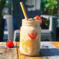 Overflowing Cassie · Banana, strawberries, almond butter, almond milk, and cacao nibs.