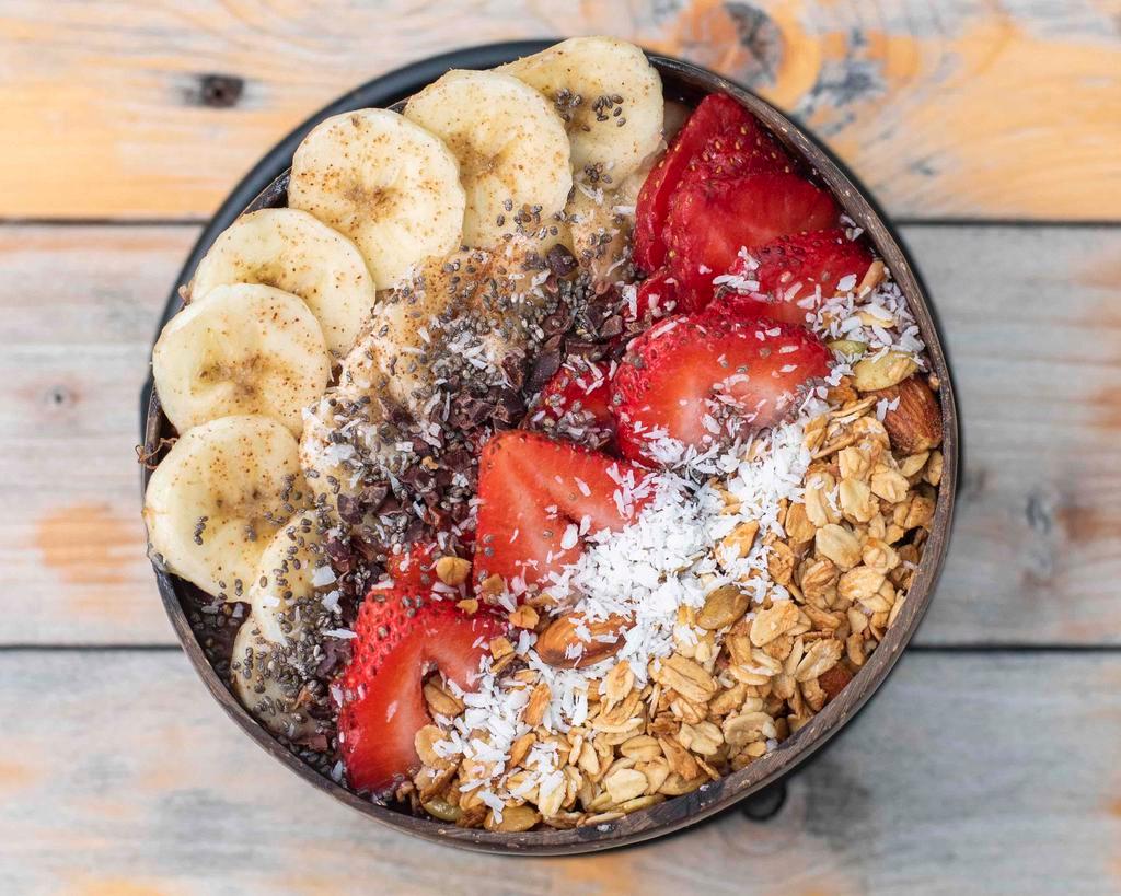 Acai Bowl · Our signature blend of acai, chia seeds, peanut butter  topped with gluten-free BOLA granola, cacao nibs, coconut flakes, fresh strawberries and bananas.