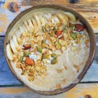 Brice's PB Bowl · Blended base of home-made almond milk, banana, frozen coconut and peanut butter. Topped with...