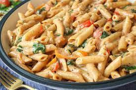 Rasta Pasta · Delicious penne pasta with a blend of peppers and onions and jerk chicken in a spicy cream s...