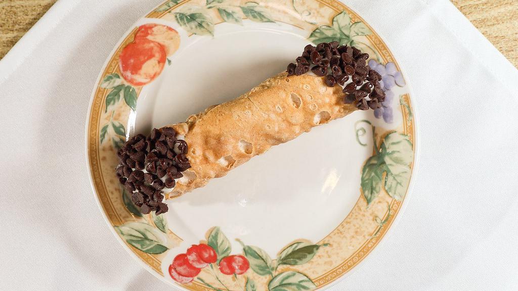 Cannoli · Italian creme filling in a crunchy shell, covered in chocolate chips. Hand made in house.