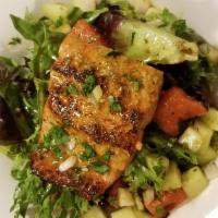 Romaine Salad w./ Salmon filet · Roasted Salmon steak served over bed of fresh mix greens salad. 