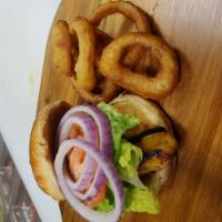 Grilled Chicken Sandwich · Served with lettuce, tomato, onion and a pickle on a bun.