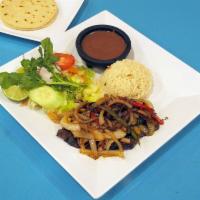Bistec Encebollado · beef steak with ring-sliced onion or with a sauce made of tomato