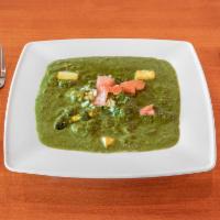 Saag Paneer · Creamed spinach and homemade cheese which spaces.
