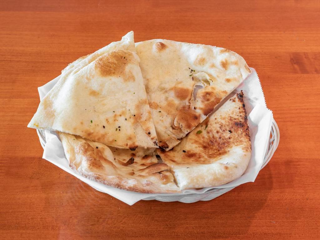 Naan  · Bread baked in tandoori oven.