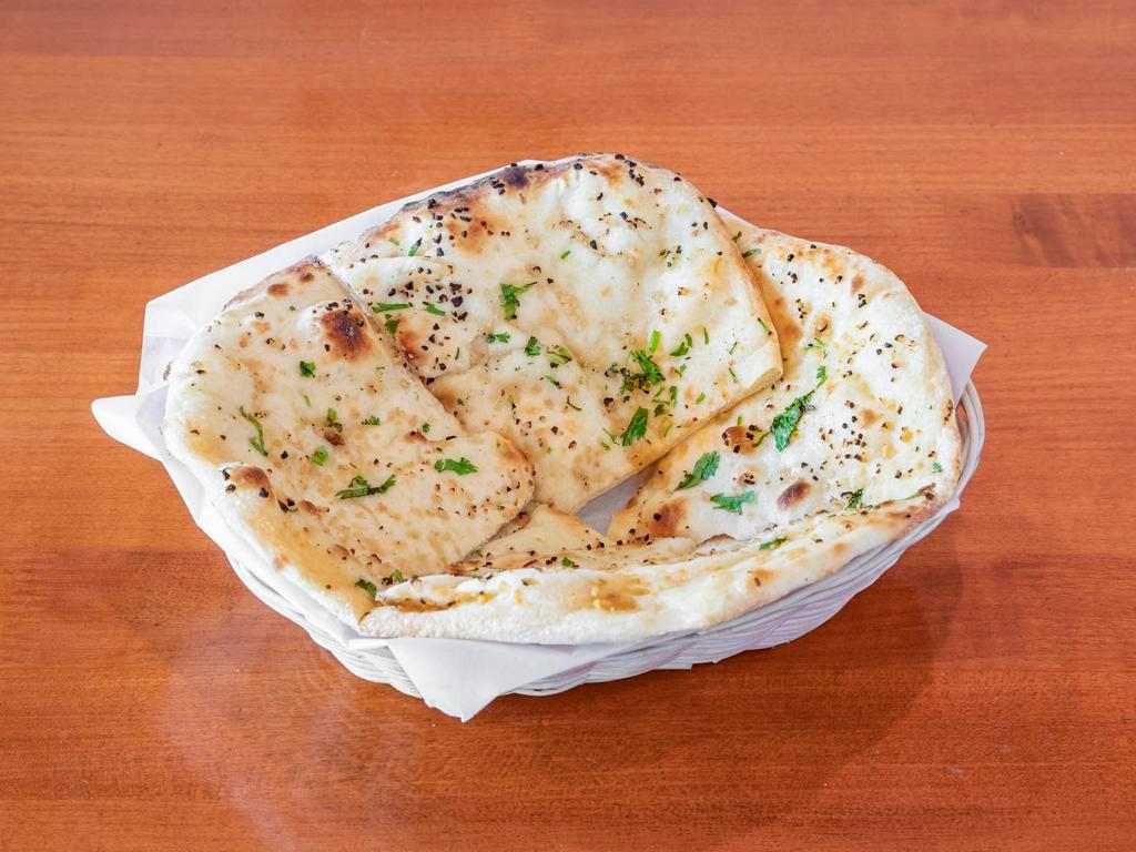 Garlic Naan  · Bread topped with garlic and baked in tandoor clay oven.