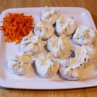 Buuz · Steam cooked bun, filled with ground beef and garnished with 2 small salad servings. Julienn...