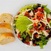Southwest Chicken Salad · Chopped romaine and spring mix, pepper jack cheese, avocado, black bean/ corn salsa, sour cr...
