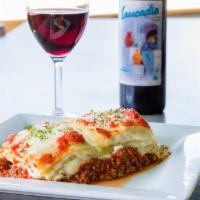 Lasagna with Meat Sauce · Layers of pasta, ricotta, and mozzarella cheese topped with our Bolognese sauce.