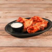 Chicken Wings · Chicken wings tossed in your choice of sauce, served with celery and your choice of bleu che...