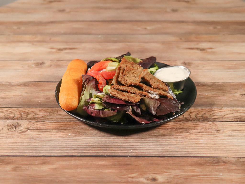 Gyro Salad · Romaine lettuce topped with tomatoes, red onions, feta cheese, gyro meat, tzatziki and ranch.