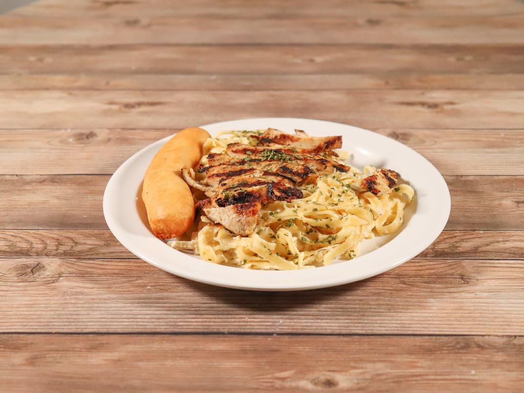 Chicken Fettuccine Alfredo · Creamy Alfredo sauce tossed with grilled chicken saved on a bed of fettuccini noodles. Try it Cajun style.