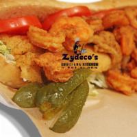 Crispy Golden Gulf Shrimp Po'boy · Crispy fried Gulf shrimp settled into a toasted french bread served with lettuce, tomatoes, ...