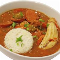 A Bowl of Savory Seafood Gumbo · A thick stew-like soup of chicken, sausage, shrimp, crab, crawfish okra, and Creole seasonin...