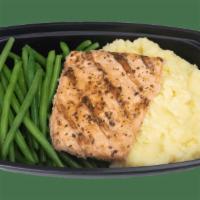 Grilled Alaskan Salmon · Grilled Alaskan Salmon served on buttery Yukon mashed potatoes with green beans (Must reheat...