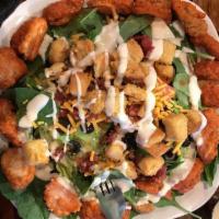 Buffalo Chicken Salad · Mixed greens, tomato, pepperoncinis, blue cheese and hot Buffalo chicken tenders.