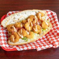 Shrimp Poboy Basket 8 Pieces · 8 shrimps battered in seasoned cornmeal and panko, mayo dressing, lettuce, tomatoes, pickles...
