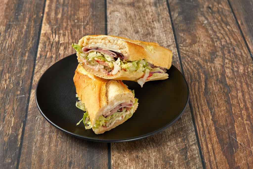 2. Smoked Ham Sandwich · Served with mayonnaise, dijon mustard, lettuce, tomatoes, pickles and onions.