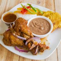 Chicken in Sauce · Served with 2 sides. Served with rice and fried plantain.