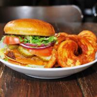 Backyard Burger · 1/2lb certified Angus beef, romaine, pickles, tomato and onions on a brioche. Served with fr...