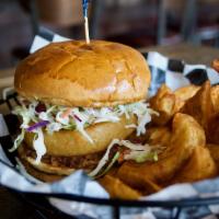 Pulled Pork Sandwich · BBQ Carnitas, Coleslaw, Onion Ring. Served with fries.