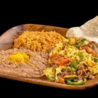 Machaca Plate · Egg and shredded beef scramble with onion, bell pepper, and tomato.