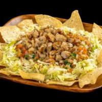 Fili's Chicken Salad · Corn tortilla chips, grilled chicken, pico de gallo, and lettuce.