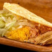 Chicken Taco · Shredded chicken in red sauce, cheese, and lettuce.
