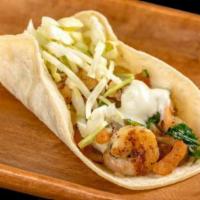 Shrimp Taco · Grilled shrimp, pico de gallo, cabbage, and tartar sauce.
