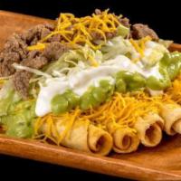 5 Rolled Tacos Cheese with Carne Asada · Shredded beef rolled tacos topped with guacamole, cheese, sour cream, carne asada, and lettu...