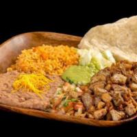 15. Carnitas Combo Plate · Grilled pork topped with guacamole, pico de gallo, and lettuce. Comes with 1 flour tortilla.