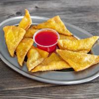 4. Crab Rangoon · 10 pieces. Fried wonton wrapper filled with crab and cream cheese. 