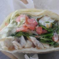 Shrimp Baja Style Burrito · Fried shrimp ensenada style, spring mix, cabbage, pico de gallo, cilantro lime dressing, moz...
