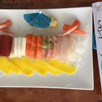 Sashimi Regular · 15 pieces of assorted raw fish. Served with soup or green salad. 