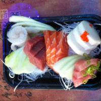 Sashimi Deluxe · 18 pieces of assorted raw fish. Served with soup or green salad. 